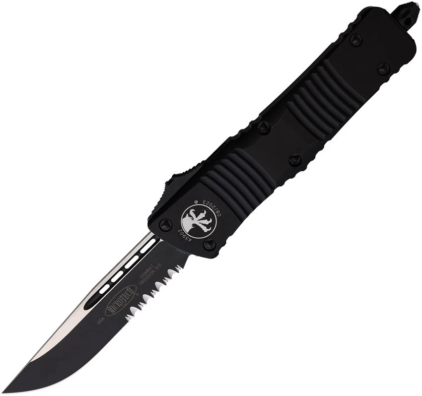Microtech Automatic Combat Troodon OTF Knife Black Aluminum Black Partial Serrated Drop Pt Blade 1432T 1 Microtech Automatic Combat Troodon OTF Knife Black Aluminum Black Partial Serrated Drop Pt Blade 1432T